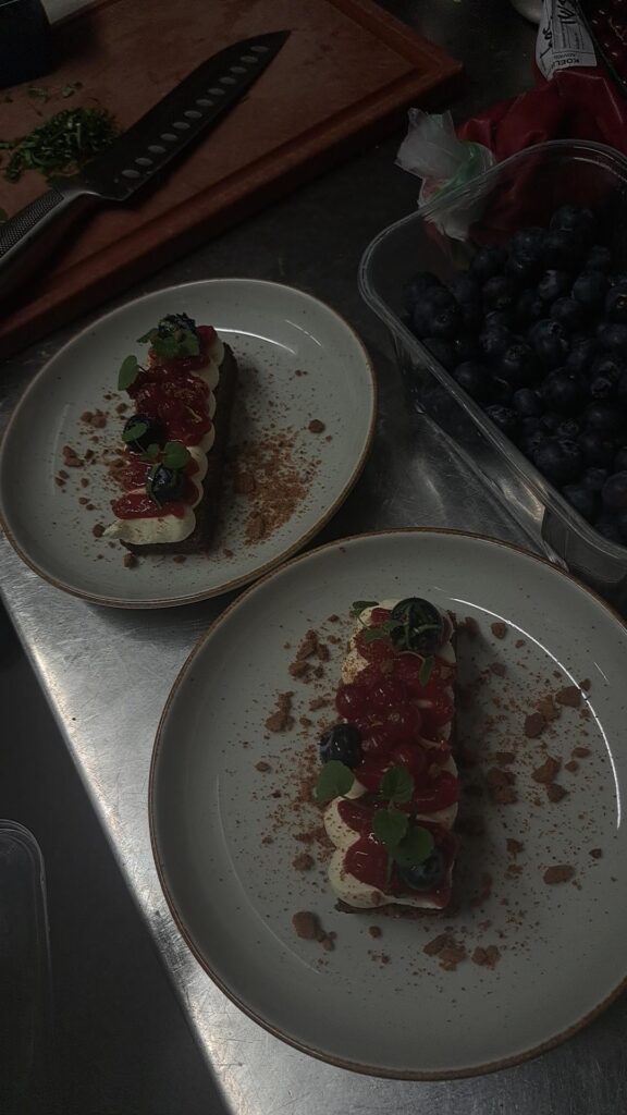 Chocolate cake white chocolate ganache red berry gel and bastogne crumble.