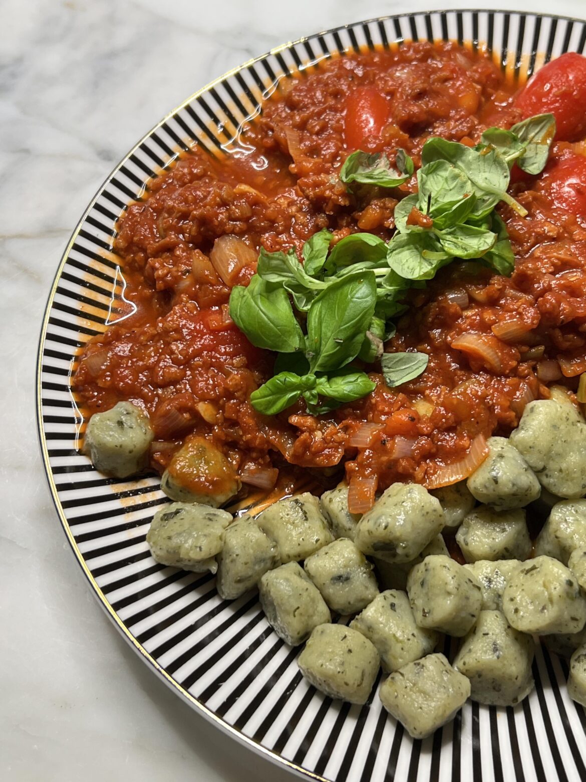 Vegan bolognese and spinach gnocchi