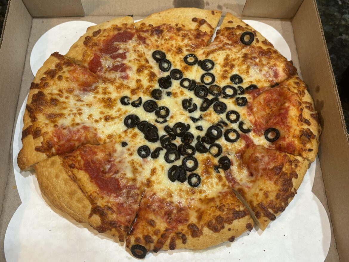 The pizza itself was delicious, but the cut job and topping distribution were just sad