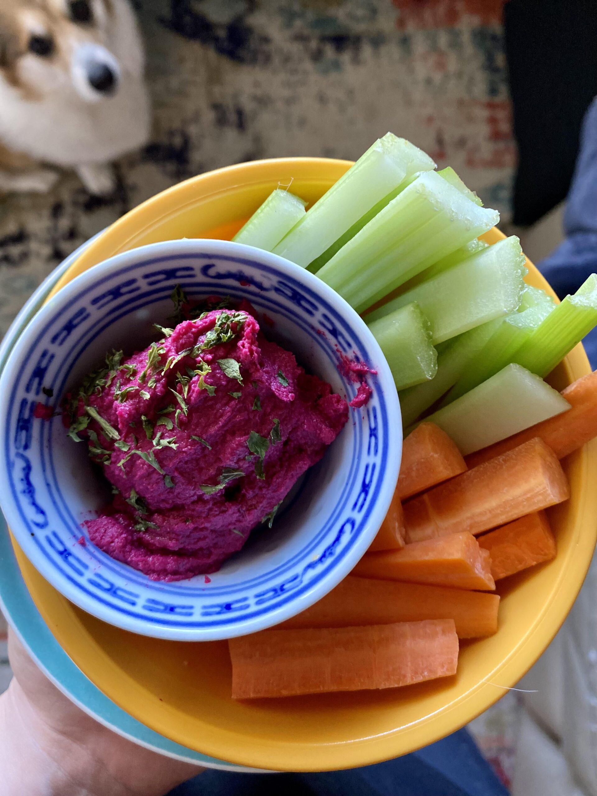 Homemade parsley sprinkled, olive oil drizzled roasted beet hummus with