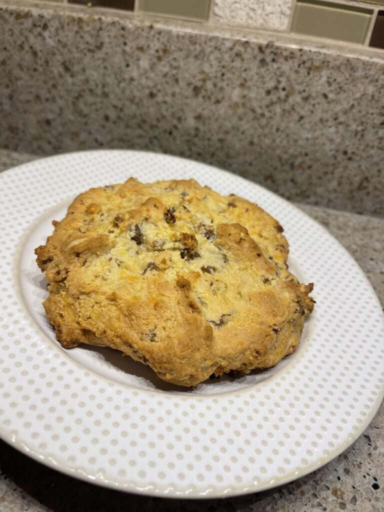 Sausage cheddar biscuits with a garlic butter topping. Sausage cheddar biscuits with a garlic butter topping.