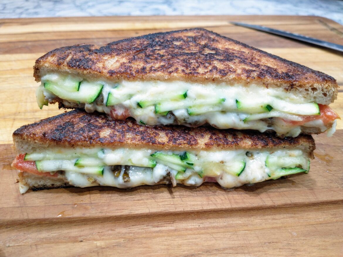 Veggie Melt - Emmental Cheese, Smoked Gouda Cheese, Zucchini, Tomato, and Roasted Beech Mushroom on Whole Wheat.