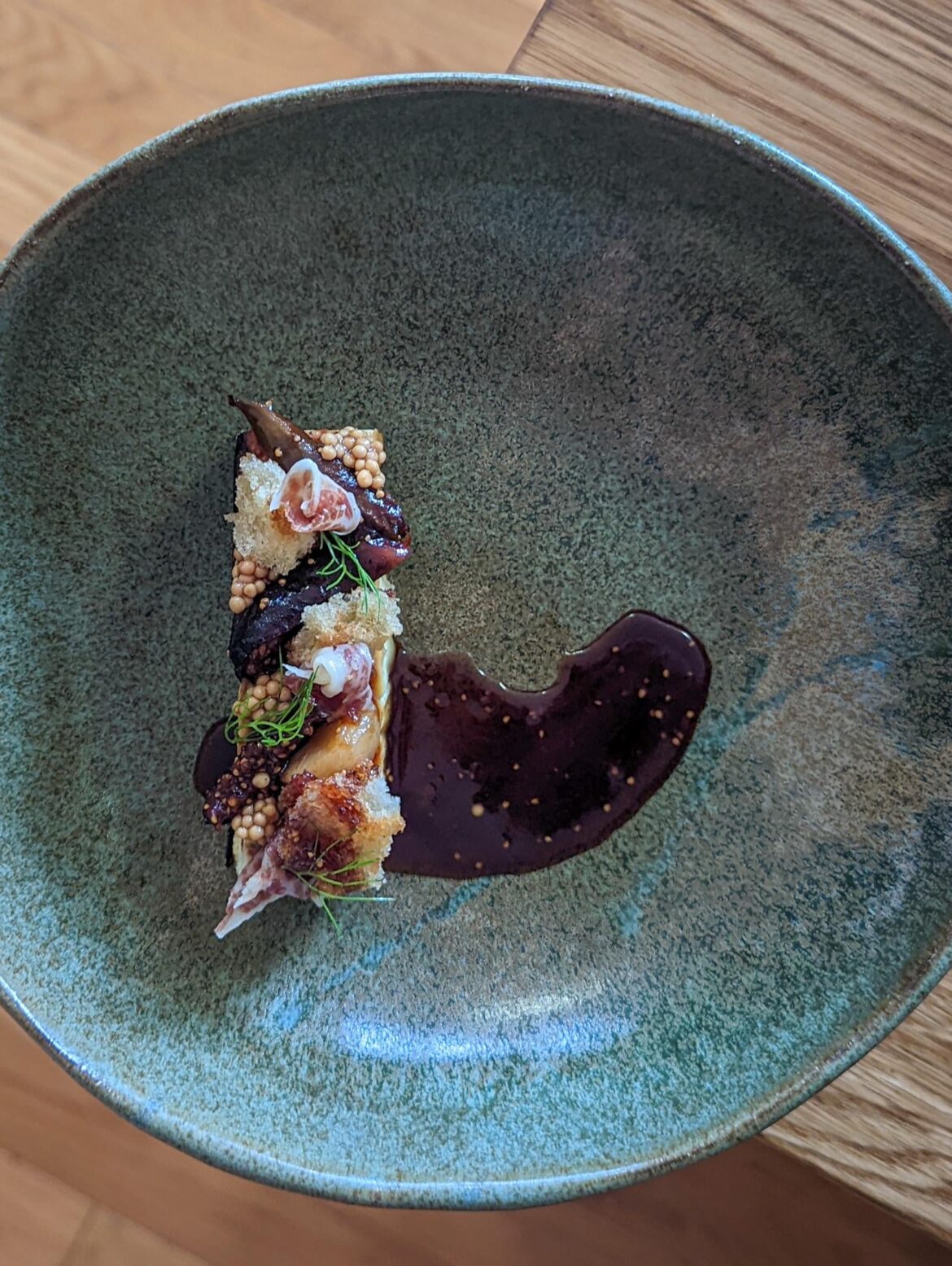 Savory goat cheese cheesecake with fig gastrique