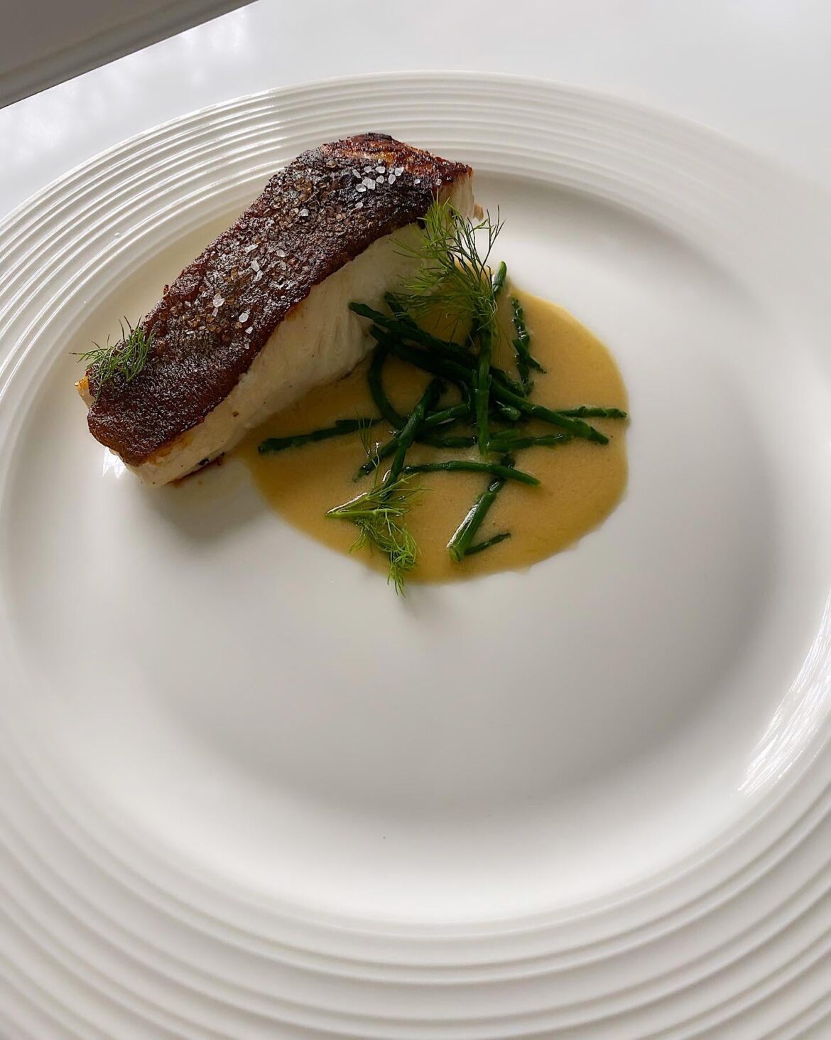 Pan seared halibut, walnut beurre blanc sauce, fennel and samphire