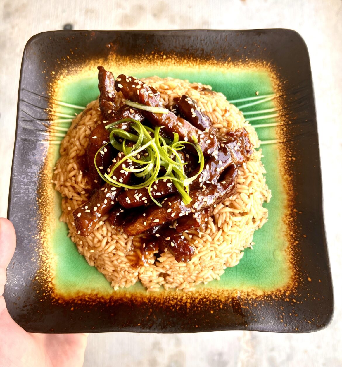 Mongolian beef, garlic rice, scallion curls