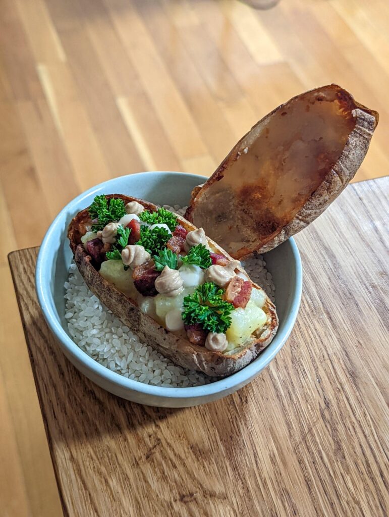 Carbonara inspired Korean potato noodles served in its crispy potato skin