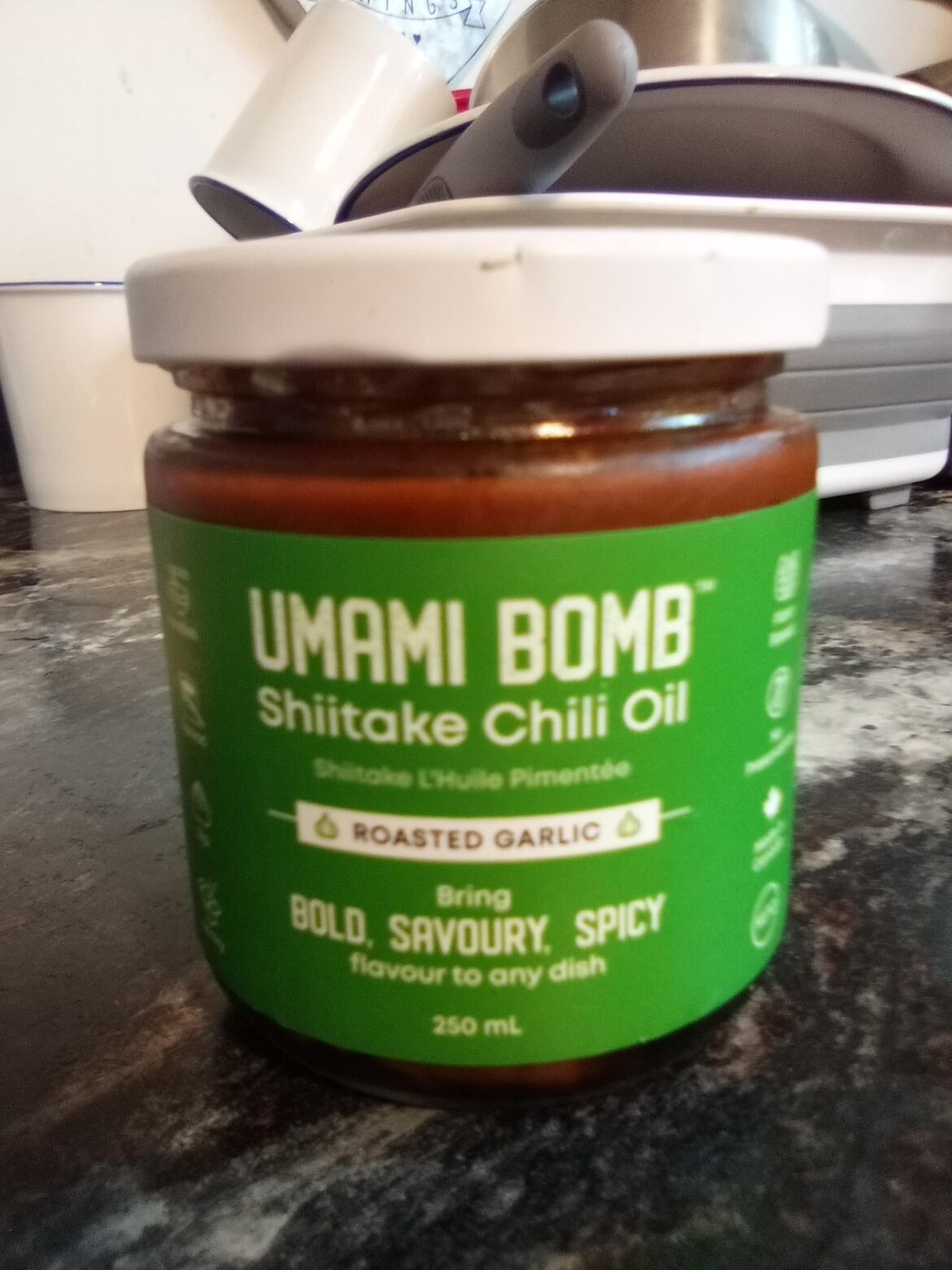 Umami Bomb Roasted Garlic Shiitake Chili Oil. Found at a local grocery store, produced on the island that I live on. Full review in comments.