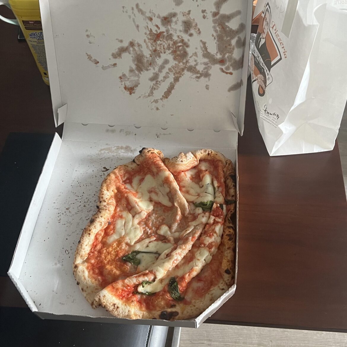 Driver had a pizza magnet which ruined the pizza