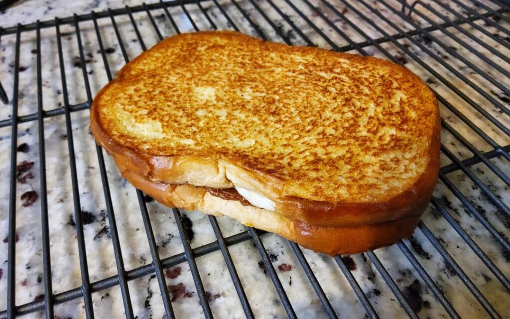 I had all the ingredients to make this quick snack. Crunchy PB, banana, and bacon grilled sandwich made with potato bread.