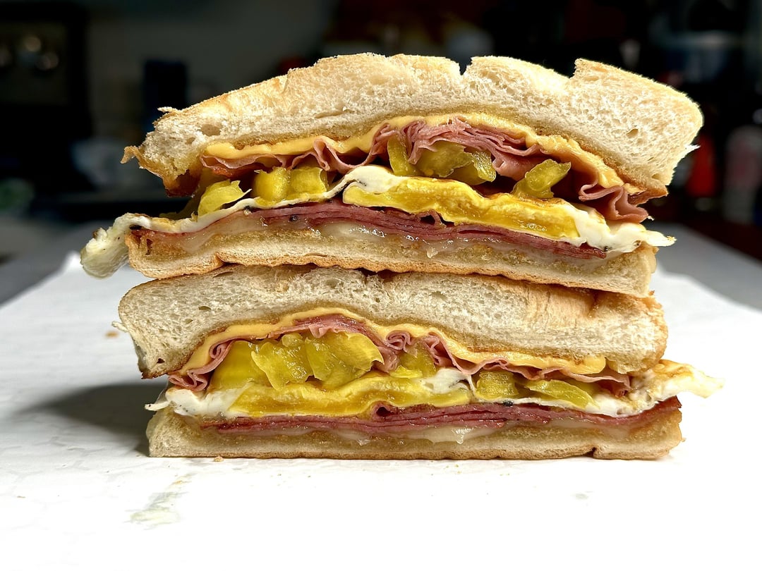 Mortadella, salami, egg, and cheese breakfast sandwich! - Dining and