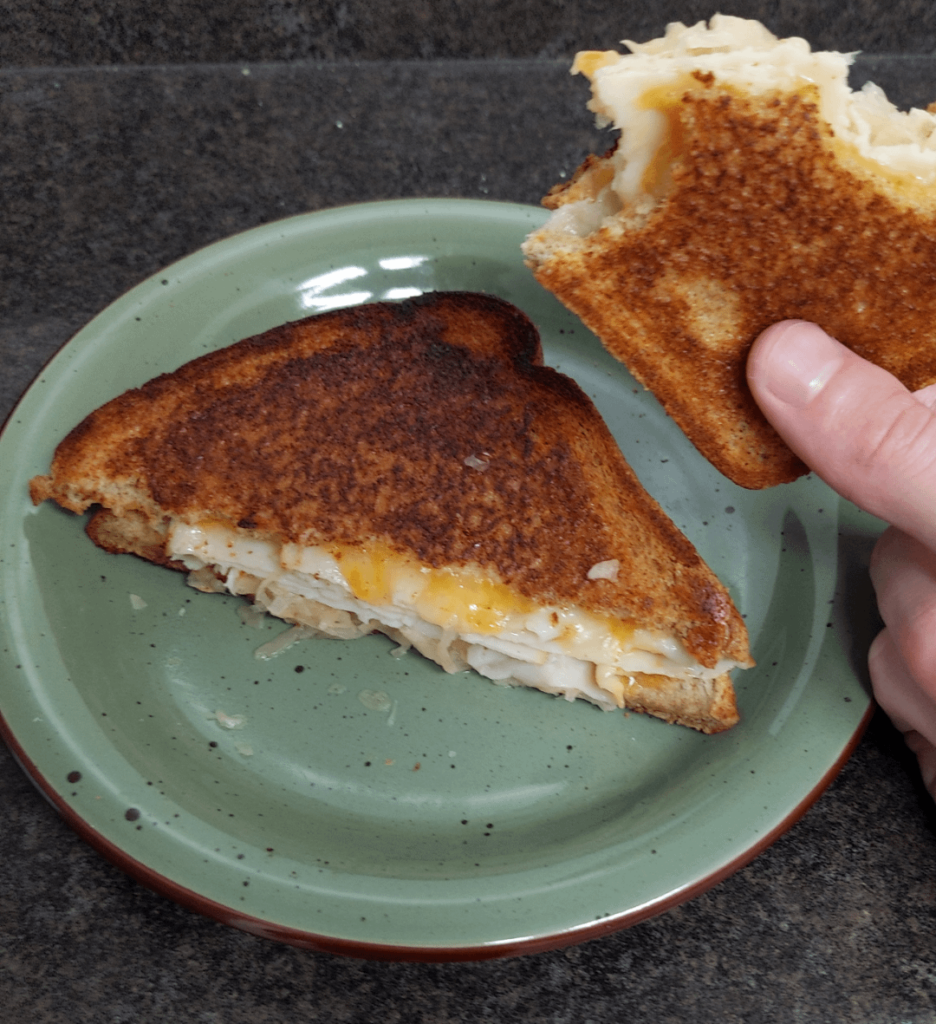 Sauerkraut, turkey, and cheese grilled sandwich.