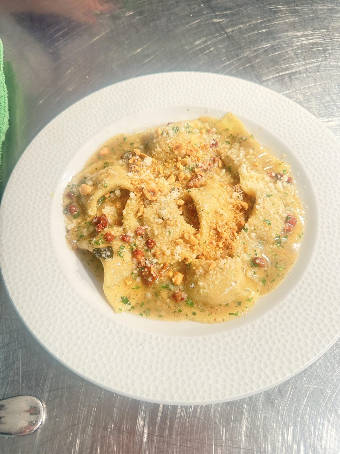 Cjarsons, stuffed with caramelized apples, pancetta, cultured butter emulsion, grana padano