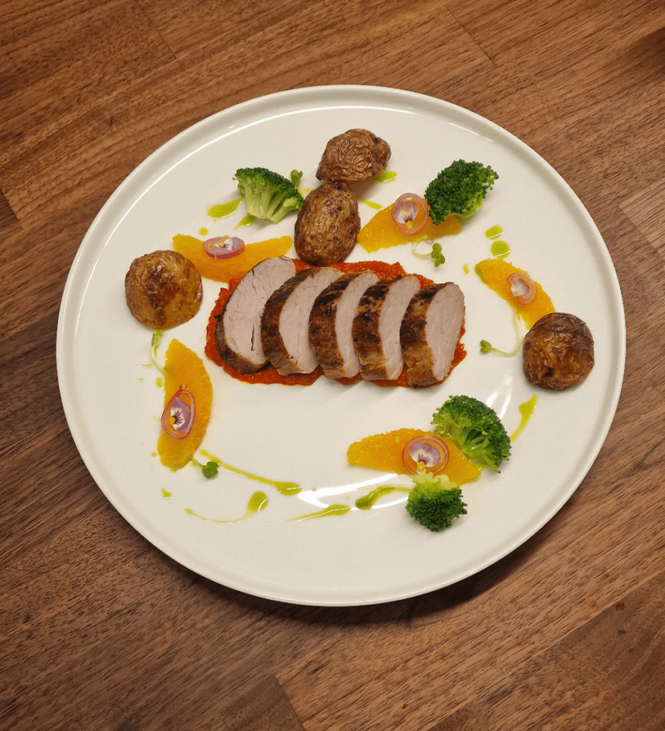 Pork tenderloin, roast baby potatoes, orange, broccoli, coriander oil, pickled shallots, ajvar, green radis shoots