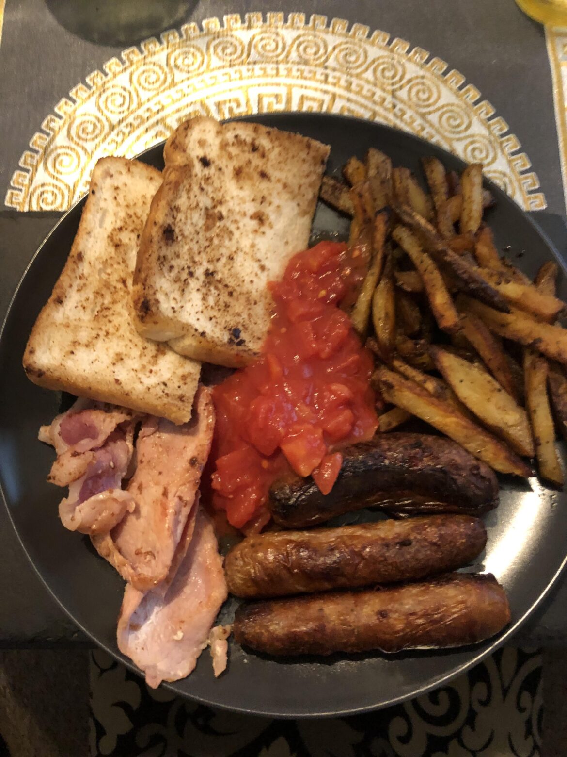 Checkout my homemade fried toast, bacon, sausages, fries and tomato sauce on middle