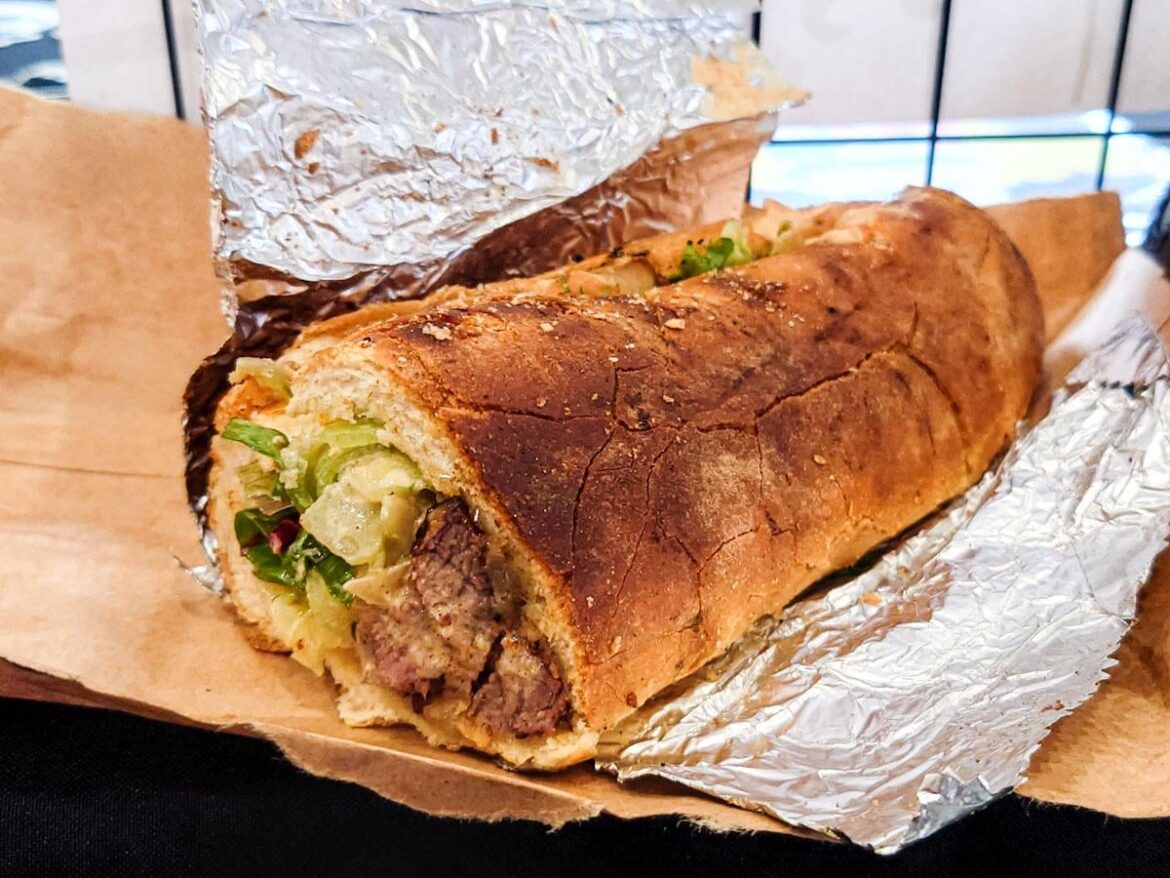 West African kabob sandwich w/ lettuce, tomatoes, and spicy mayo