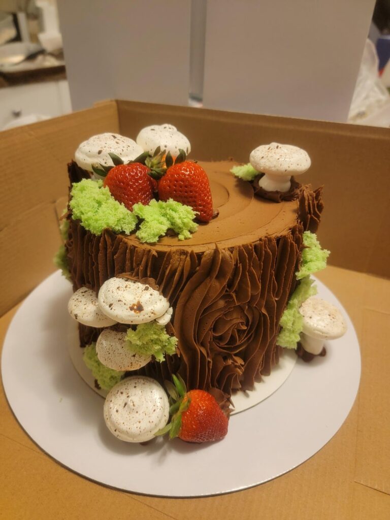 Woodland tree stump cake with meringue mushrooms
