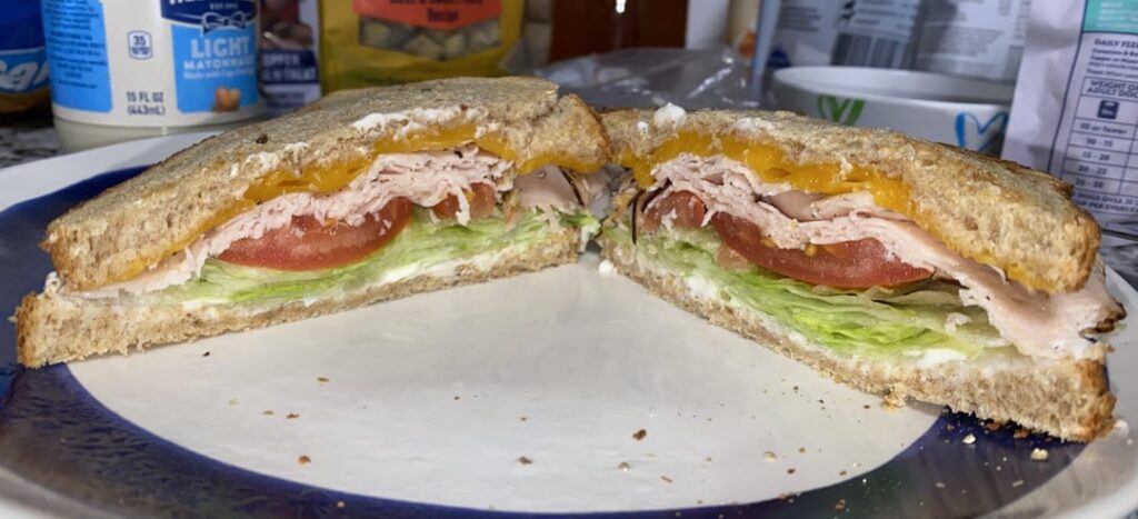 Simple but Delicious Maple Honey Turkey, lettuce tomato Mayo pepper, side of half cool ranch&salt & vinegar chips