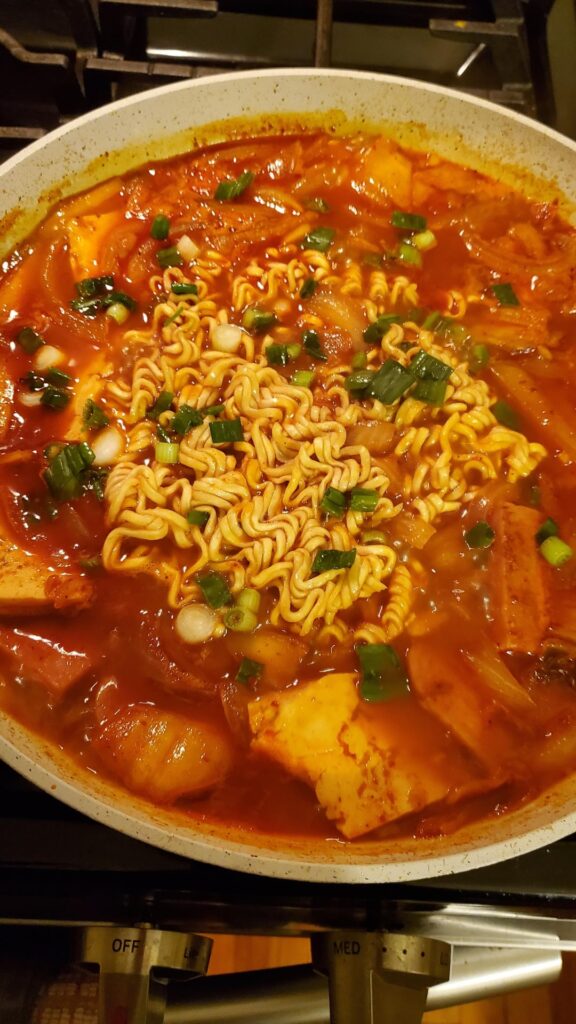 I had mostly all the ingredients spam, onion, garlic, tofu, Bush's baked beans, kimchi to make this Army stew Budae jjigae. I used Buldak spicy stir fry ramen.