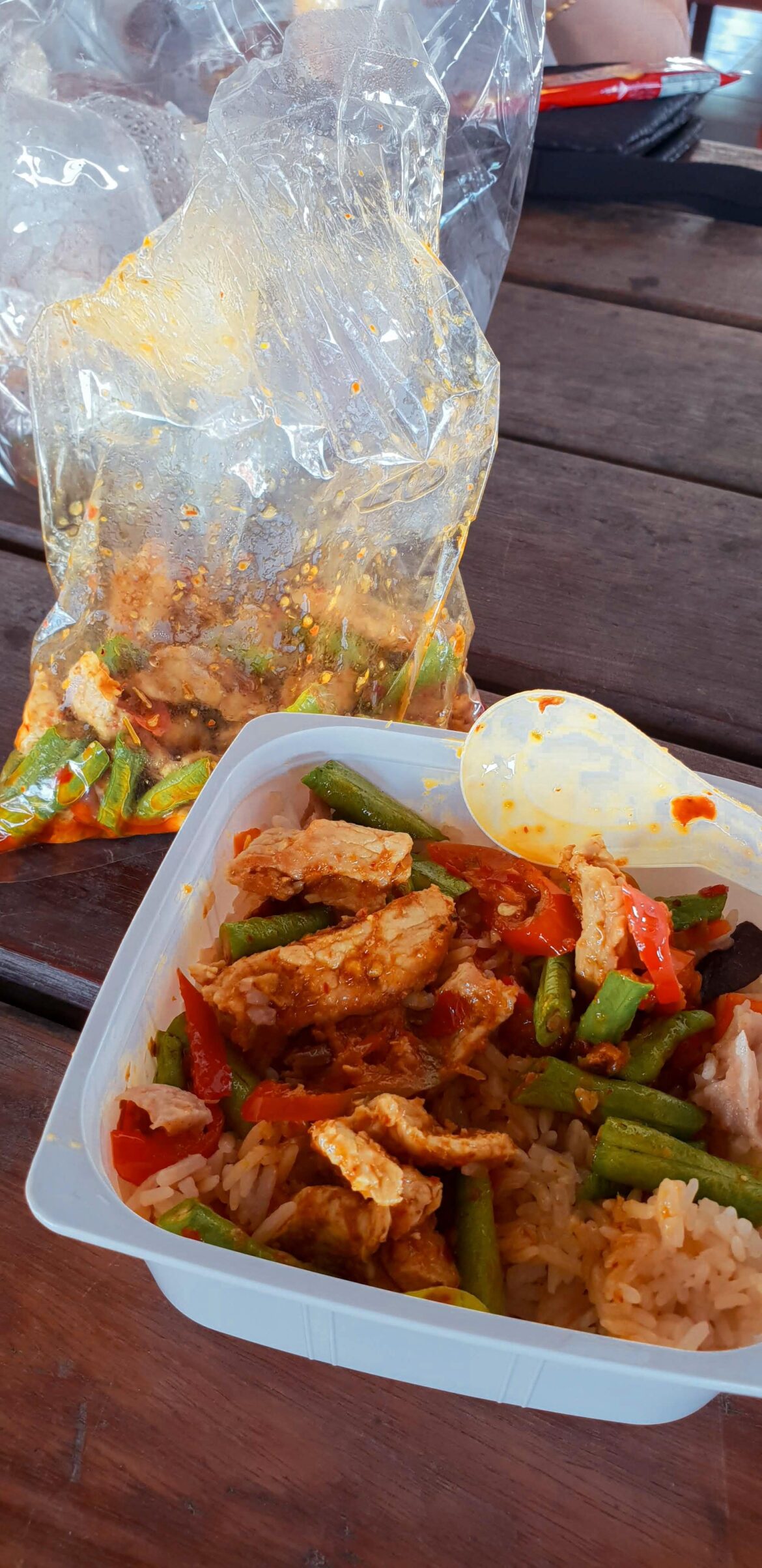 A fiery Thai street food dish called Prik Gaeng. A "dry curry" stir fry with protein, lime leaves and long beans