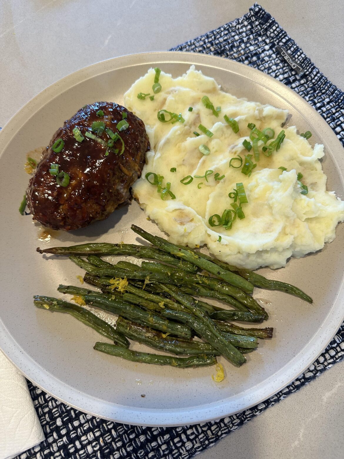 Brown sugar bourbon meatloaves with mash potatoes and green beans.