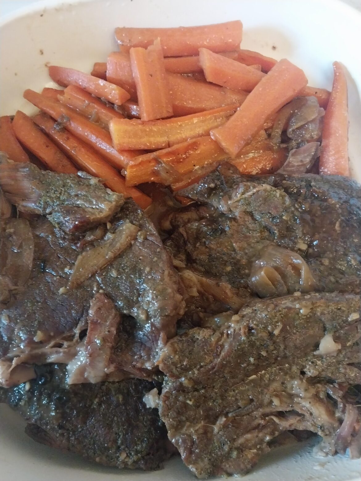 A couple of thick cut chuck steaks and carrots in beef gravy with onions, green peppers and a Jalapeño.