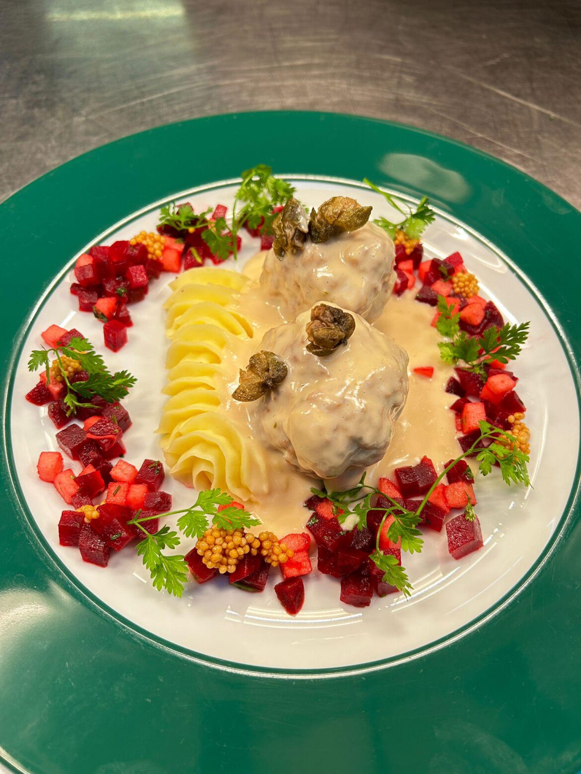 "Königsberger Klopse" Meatballs with white caper sauce, potato mousselin, beetroot and apple salad, mustards seeds, fried capers