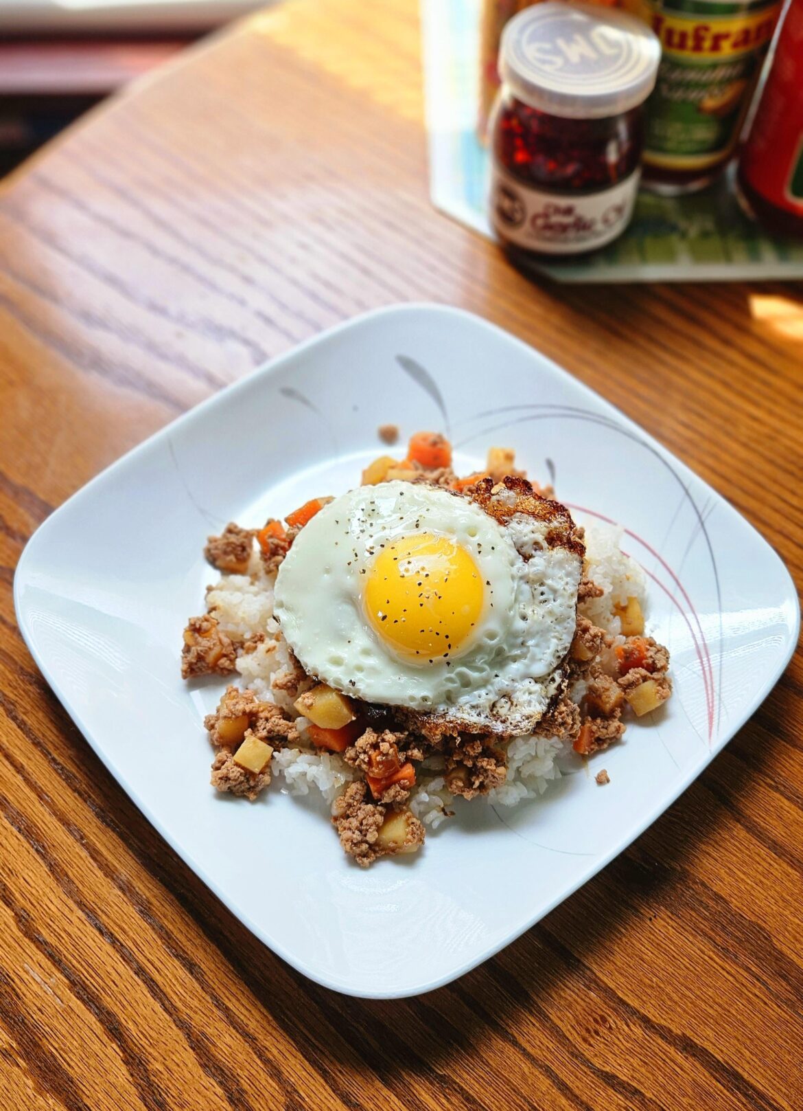 Sunny side egg on Filipino Picadillo over steamed rice.