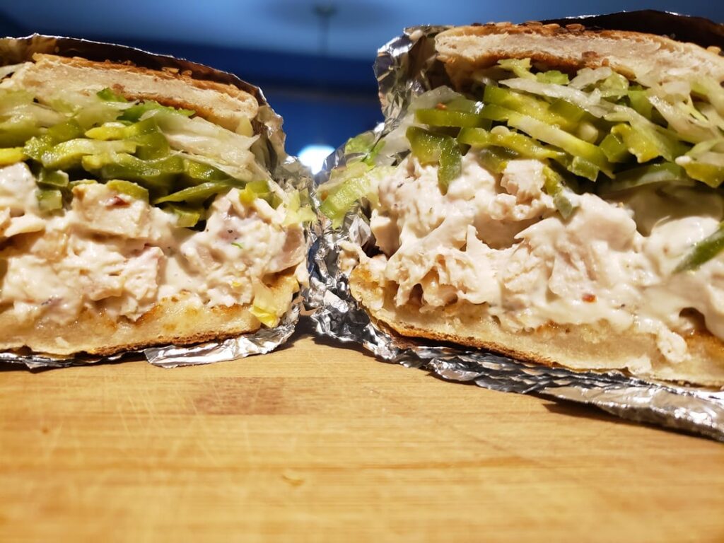 Chicken salad w/ shredded lettuce and pickled jalapeños. On an everything bagel.