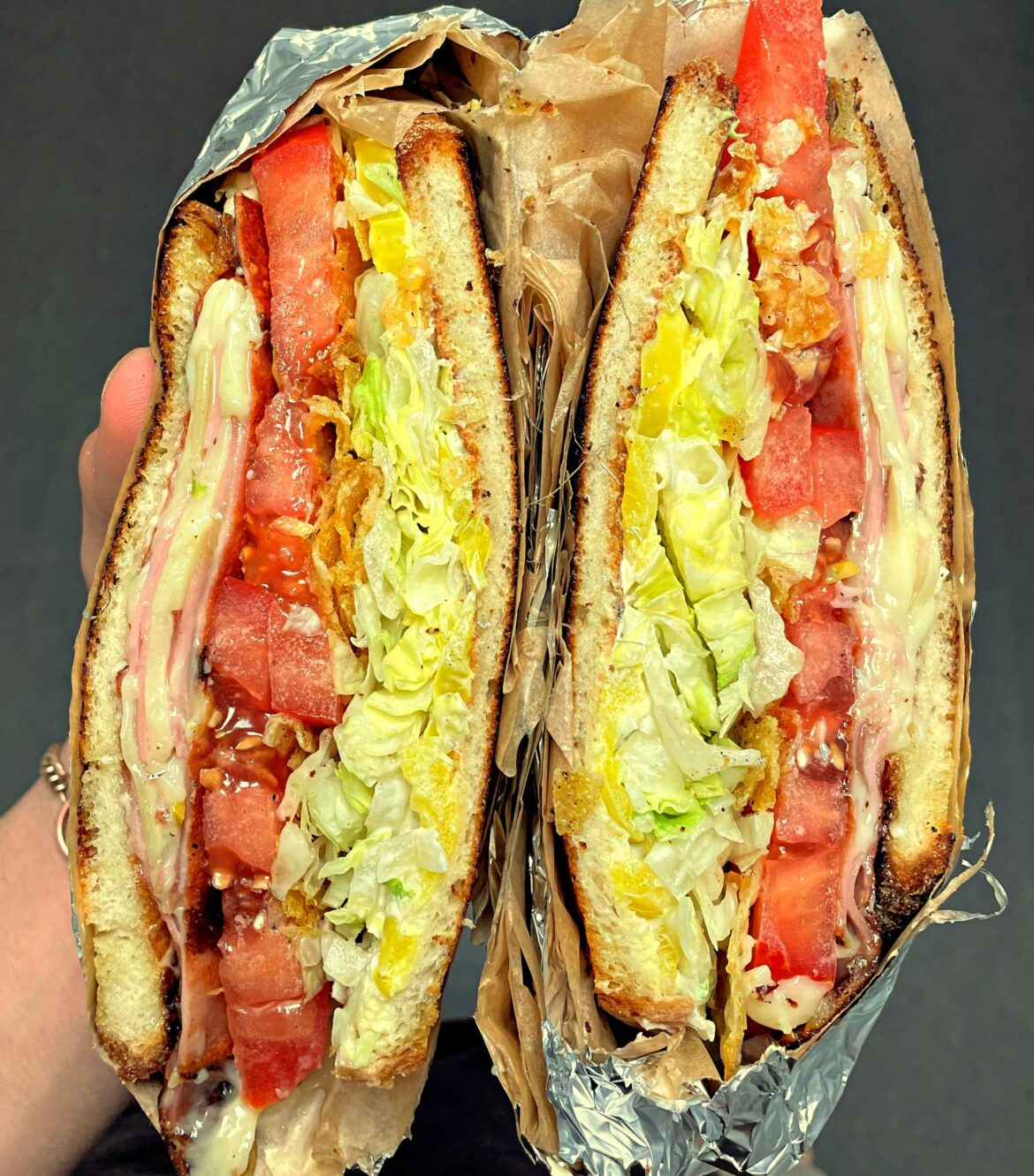 fried mortadella, melty american, heirloom tomato, shredduce dressed in pepperoncini juice, banana pepper mayo, crushed up chips on toasted amoroso italian bread