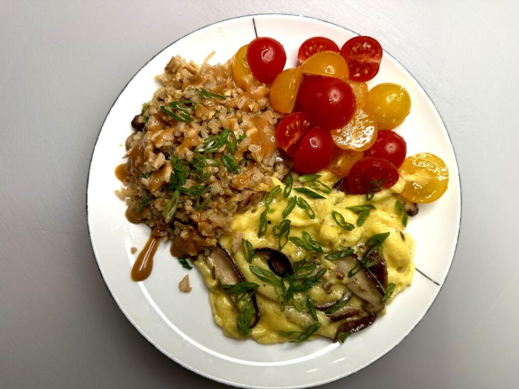 scrambled eggs and fried rice breakfast.