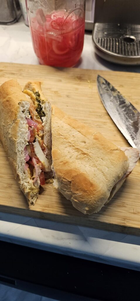 Chicken caprese with Home made pickled red onion, cucumber, and dijon