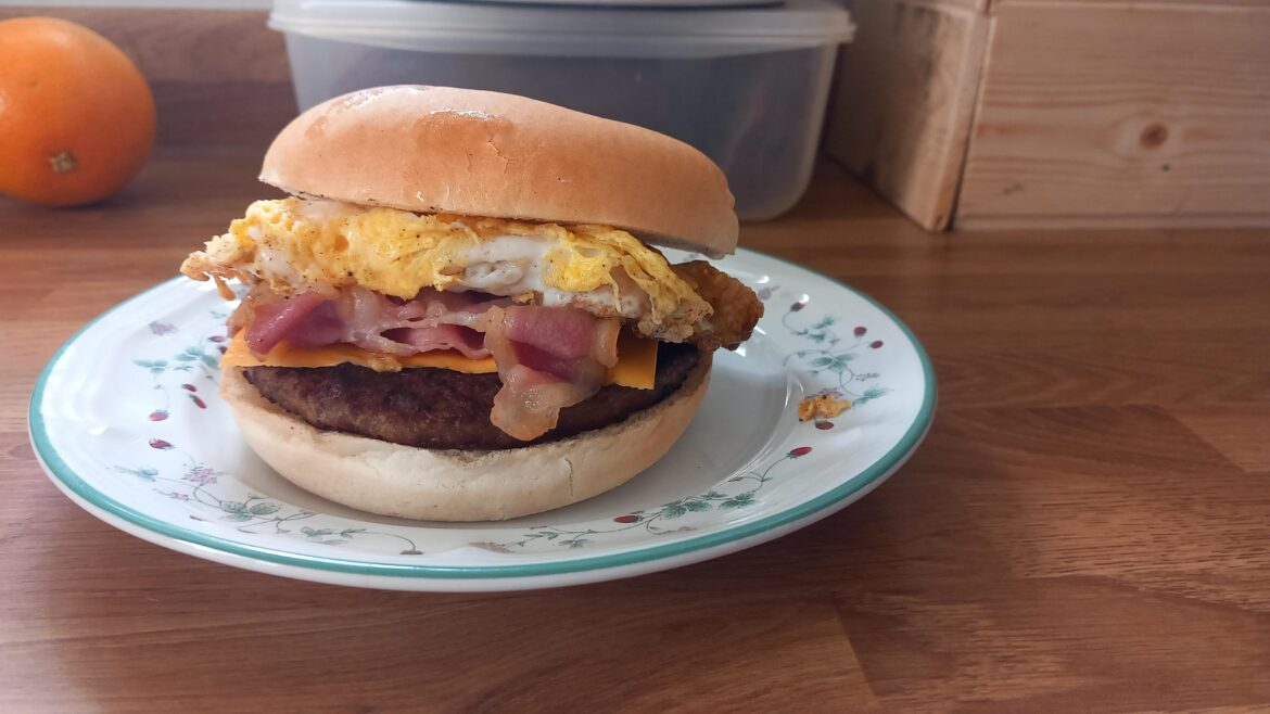 I added egg and bacon to a rustlers microwave burger to make a yummy breakfast