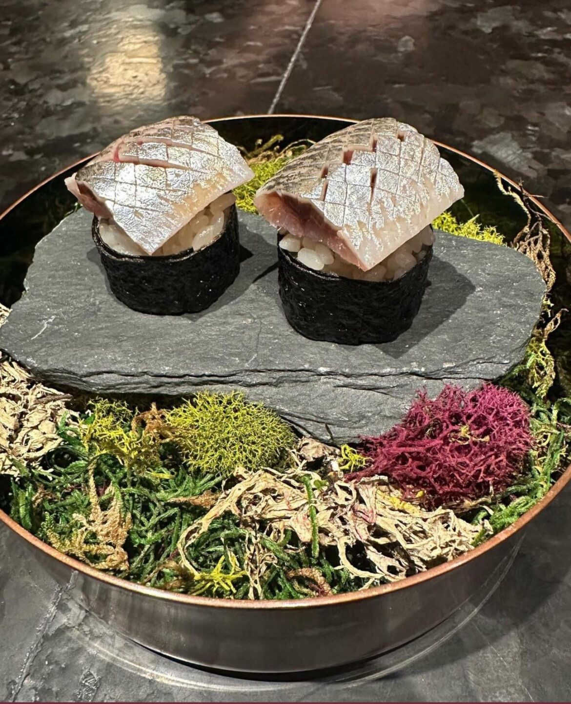 Sushi on a rock thats resting on a bed of moss ???? Cred: instagram @pastawithwhatever