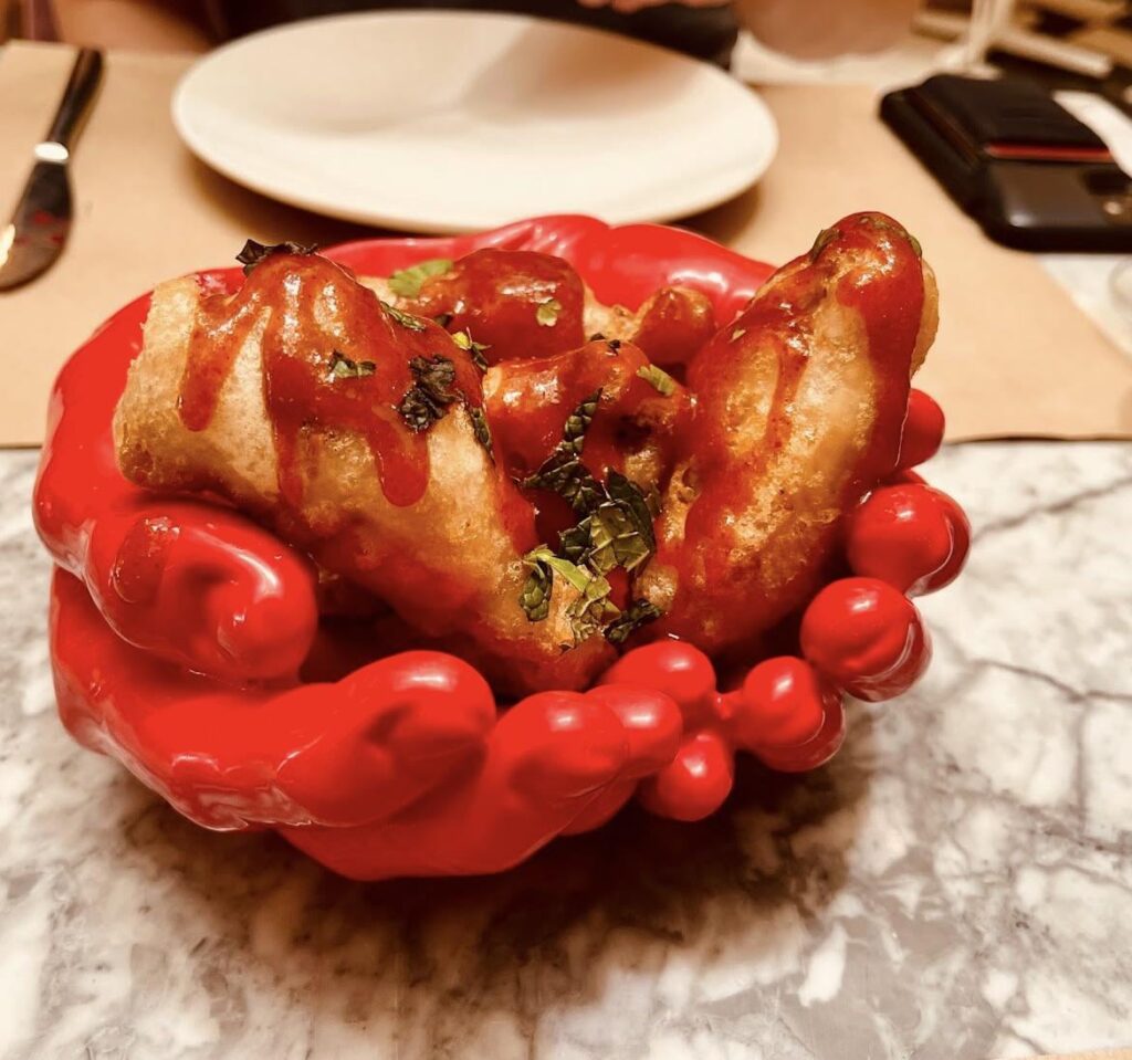 Restaurant in Spain. I love my dishes served in ceramic that looks like bloody hands 🥰.
