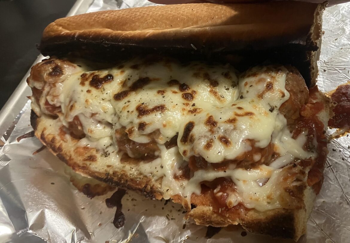 Quick meatball parm on garlic bread roll.