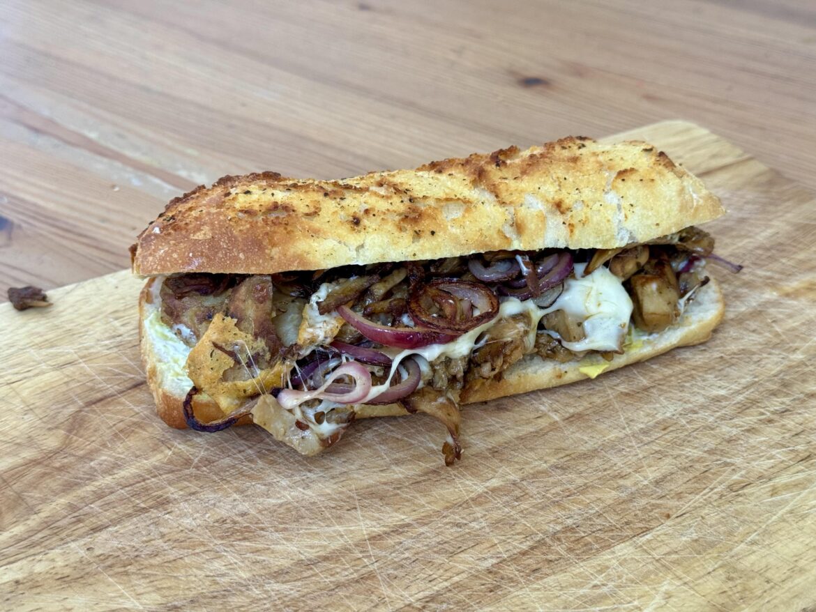 Vegan Döner, cheese and onions on a focaccia role