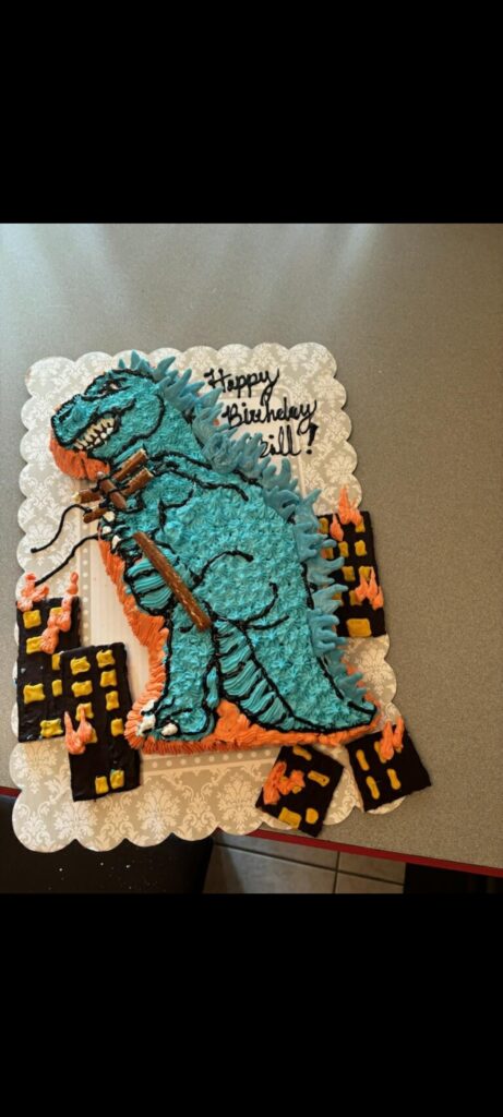 Godzilla cake for my son's 5th birthday, using the good old Partysaurus Wilton pan