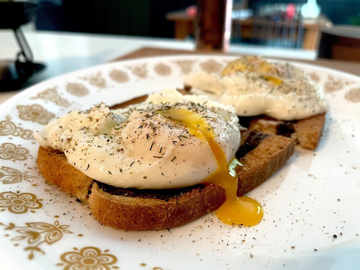 Two poached eggs over marbled rye toast