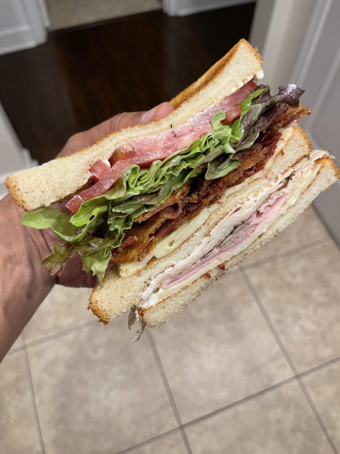 Club sandwich with thick cut apple wood bacon, Boars head SmokeMaster ham, Boars head flame kissed chicken and carmalized onion Jack cheese. Turkey or Chicken on a club?
