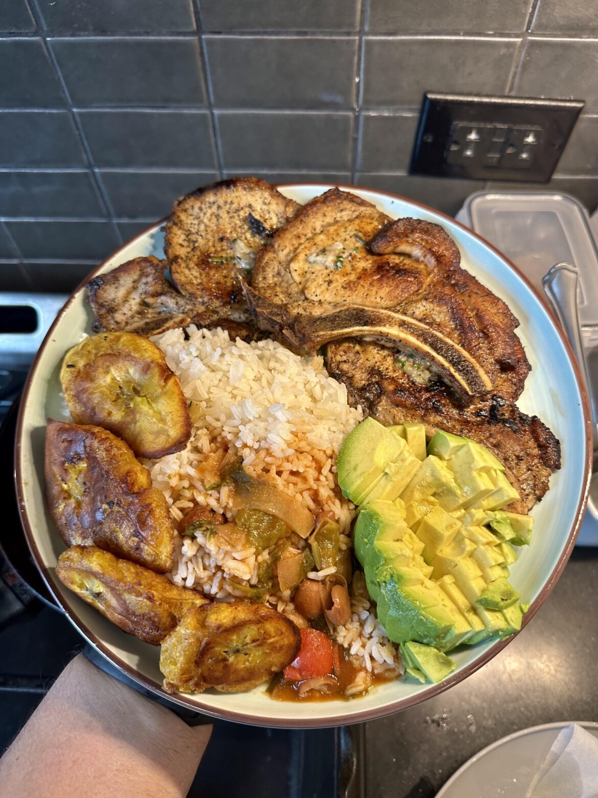 Pork chops, rice, beans, fried plantains and avocado [homemade]
