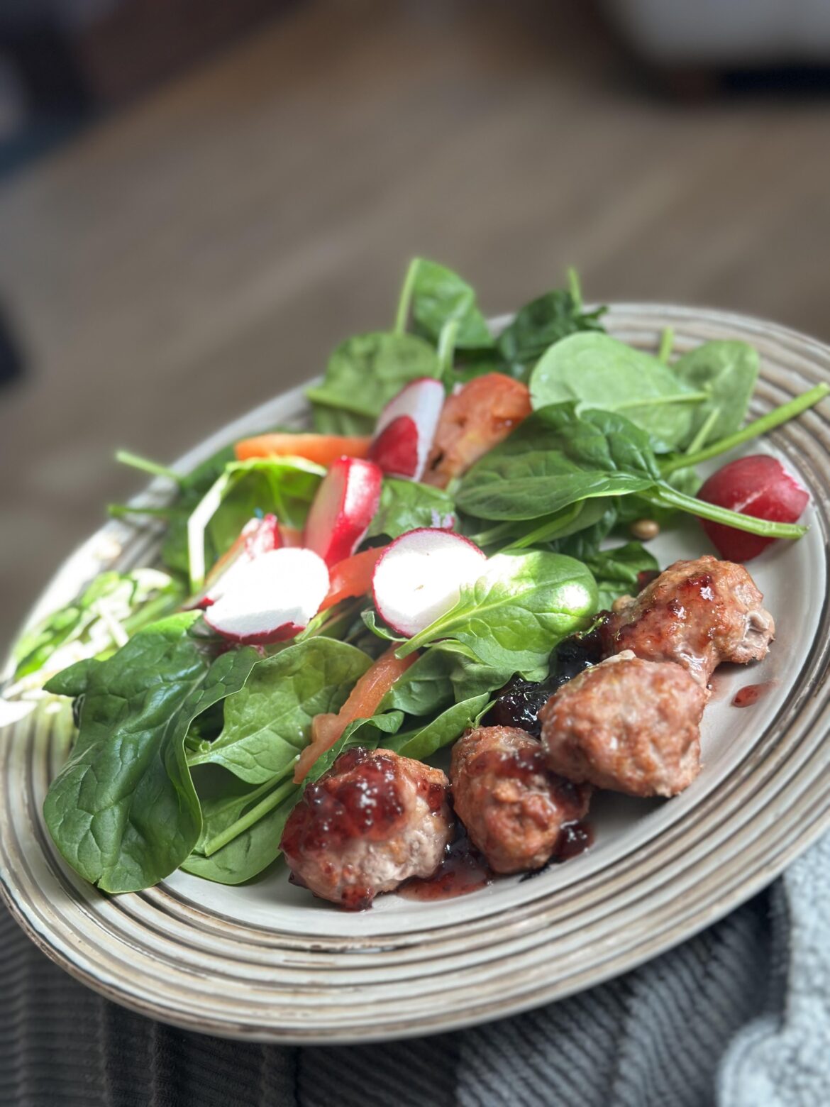 Cranberry smoky meatballs with salad