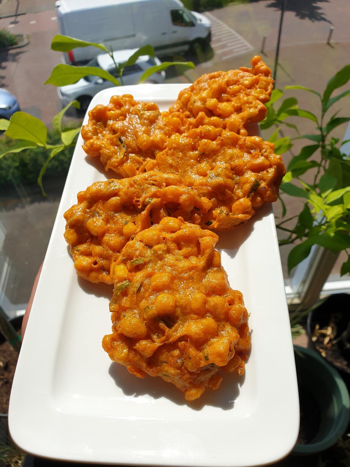 Tod Man Khao Pod (Thai Corn Fritters) with spicy peppers