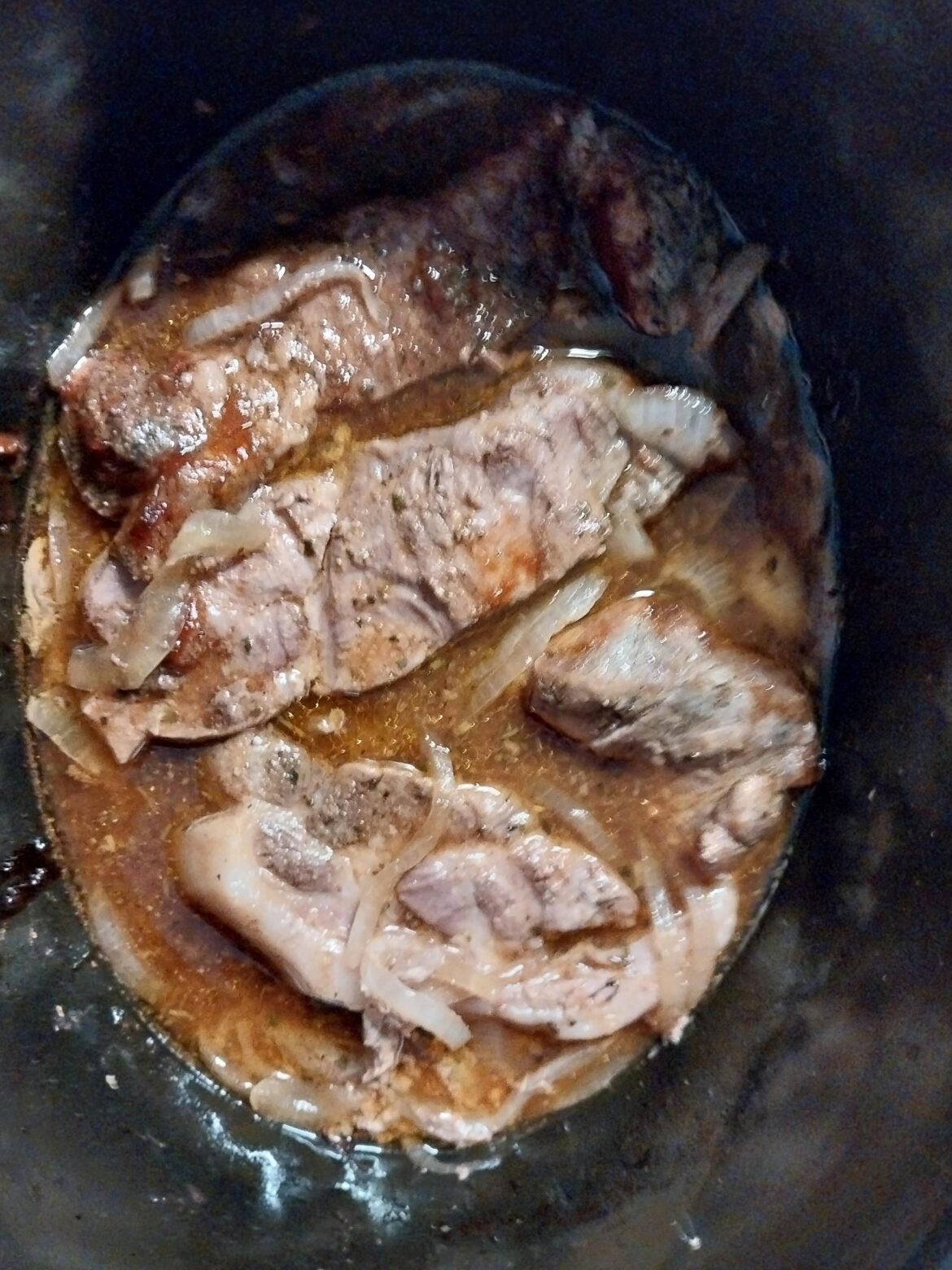 5 hours into a 7 hour slowcook on low - pork country ribs that will eventually become pulled pork.