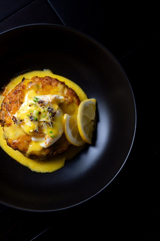 Crab and shrimp cake egg Benedict with hollandaise sauce.