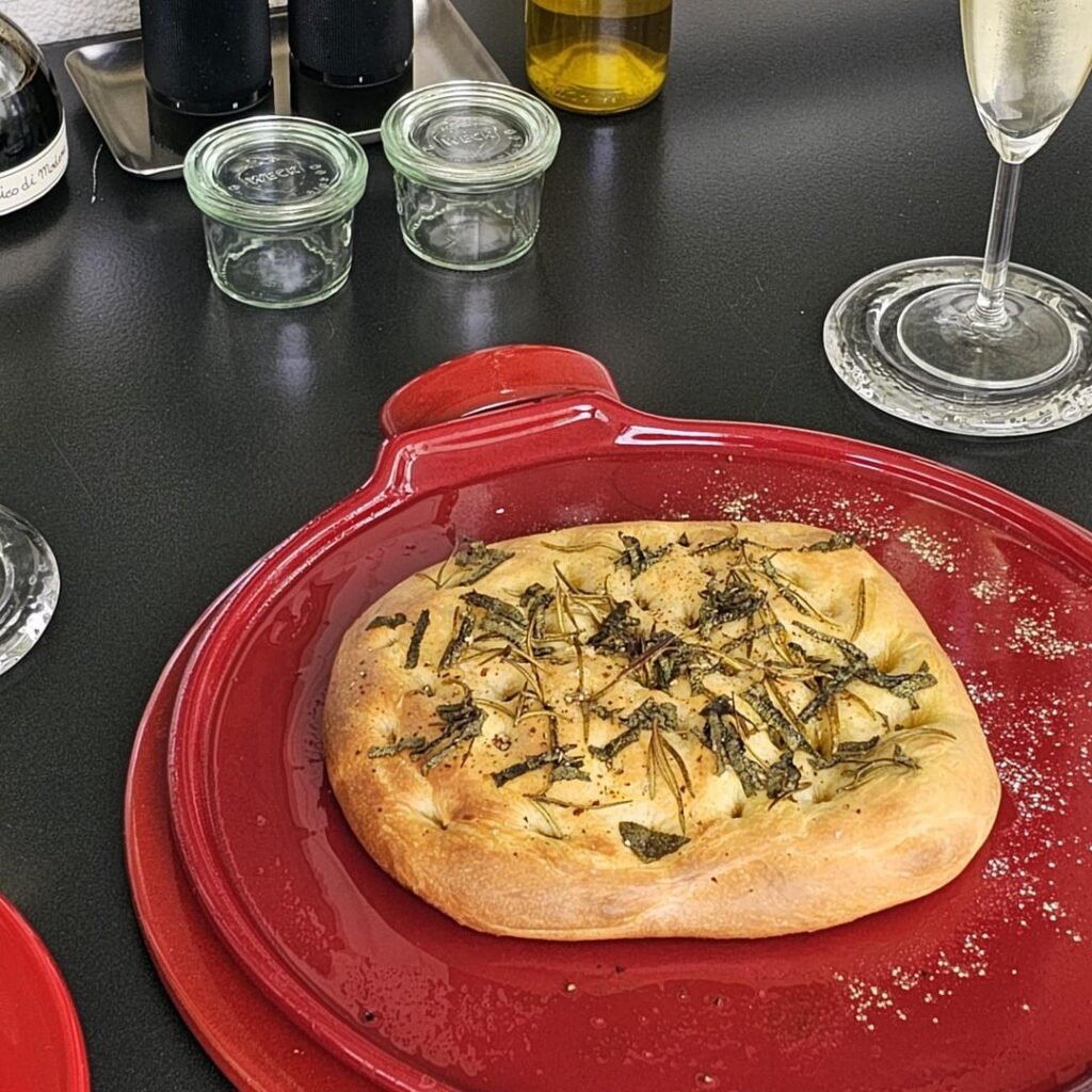 Focaccia made from leftover pizza dough (in addition to the obligatory rosemary, we also like to add a little sage)