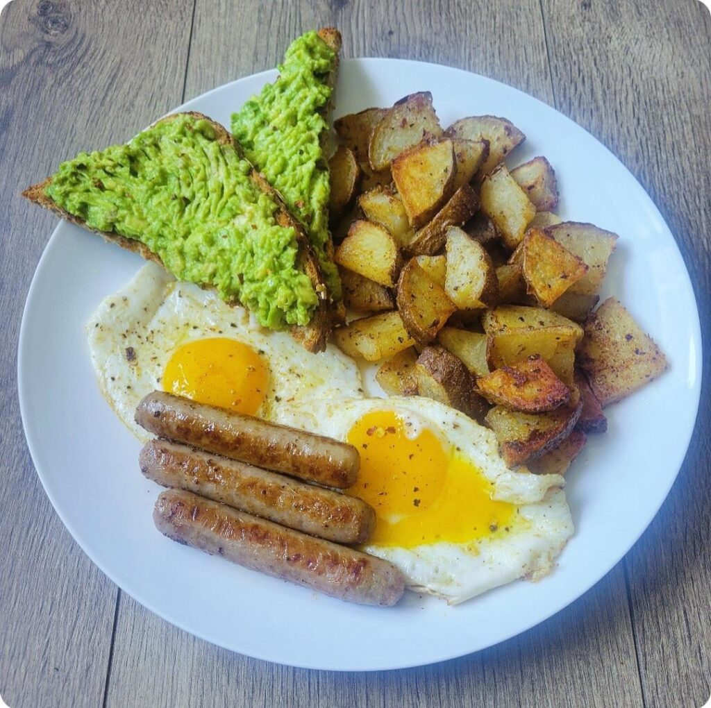 Breakfast platter! Eggs, sausage, potatoes, avocado toast.