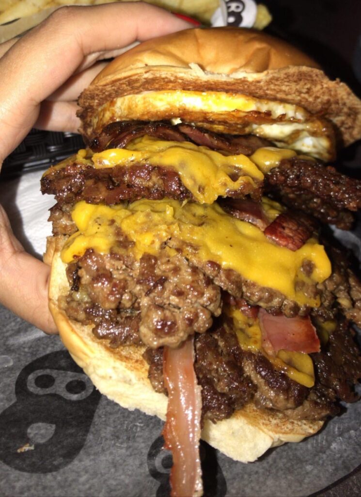 Triple cheeseburger with bacon and egg