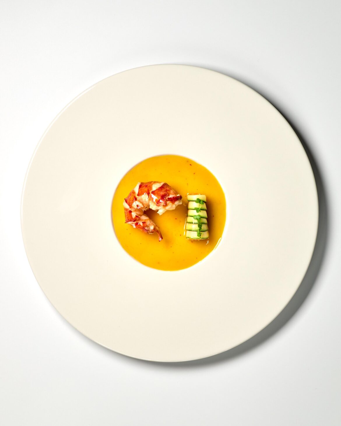 Lobster with a saffron and lime beurre blanc, zucchini filled with carrot puree and lobster claws