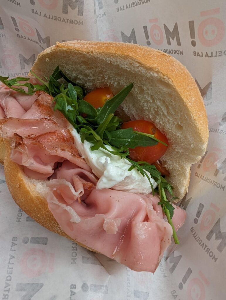 Mortadella, buffalo mozzarella, tomatoes, and rocket greens from Mò Mortadella Lab in Bologna, Italy