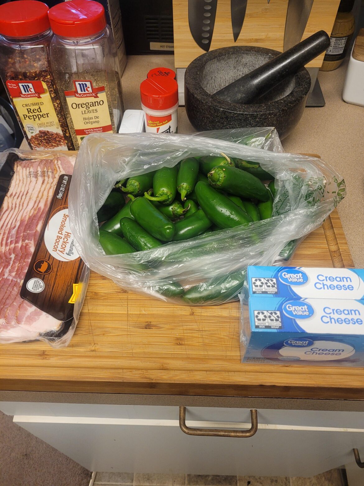 Getting some bacon wrapped jalapeño poppers ready. My shopper thought I meant I wanted pounds of them so I have to use them up. They are much spicier than a normal pepper.